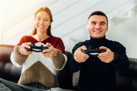 Best Friends Having Fun While Playing Computer Games At Home Stock