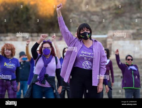 A Woman Seen Rising Her Fist As She Takes Part In A Feminist Flashmob