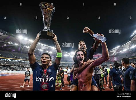 Thiago Silva Left Of Paris Saint Germain Holds Up The Champion Trophy