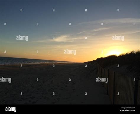 Romantic beach sunset Stock Photo - Alamy