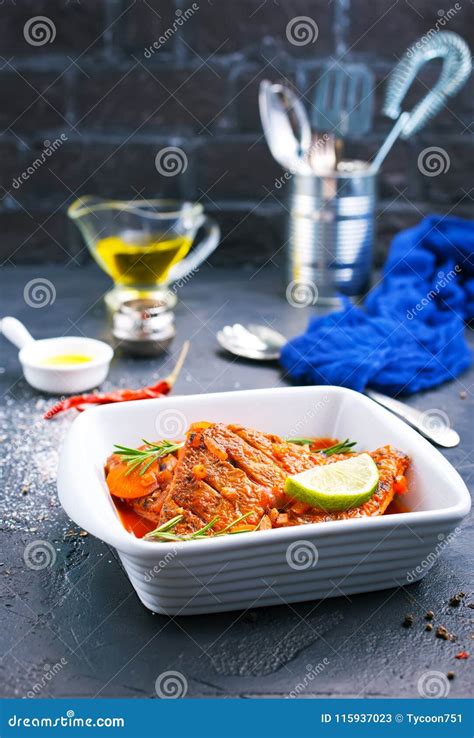 Fish with tomato sauce stock image. Image of pollack - 115937023