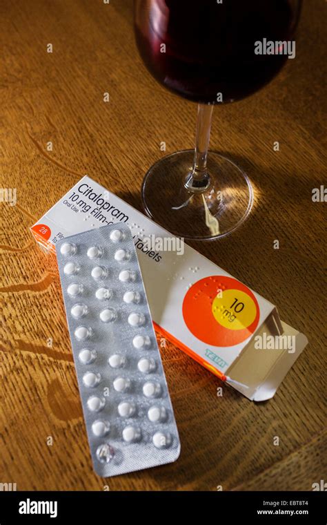 Antidepressant Tablets And A Glass Of Red Wine Stock Photo Alamy