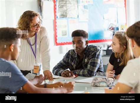 students talking classroom desk  res stock photography  images alamy