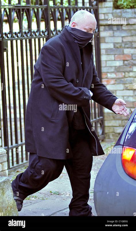 Boy George Leaving His Home Wearing A Scarf Covering His Face London