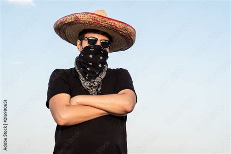 Young male person dressed up as gangster in traditional sombrero ...