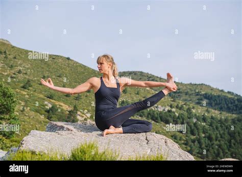 yoga poses woman mountain Stock Photo - Alamy