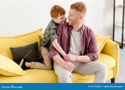 Happy Father And Son Smiling Each Other While Spending Time Together