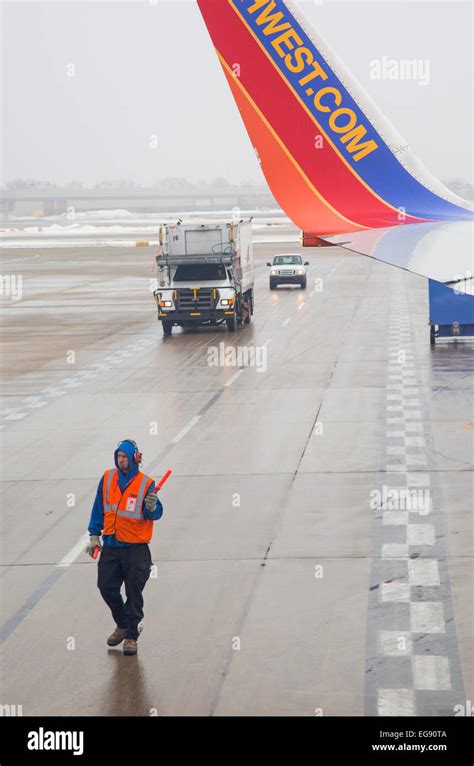 Chicago, Illinois - A member of the Southwest Airlines ground crew at ...