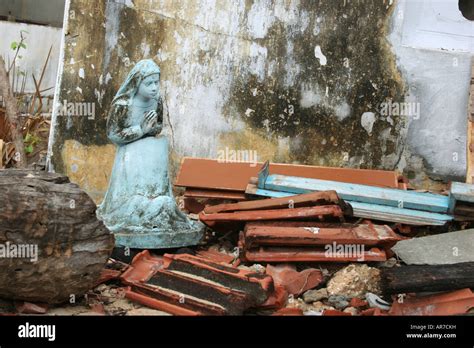 Statue Of Praying Woman In Between Rubble Caused By The Tsunami Near