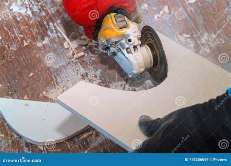 Worker Using An Grinder Cutting A Floor Tile Stock Image Image Of