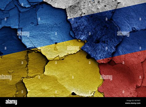 Flags Of Ukraine And Russia Painted On Cracked Wall Stock Photo Alamy