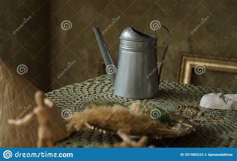 Vintage Metal Jug And On Green Table With Copy Space Stock Image