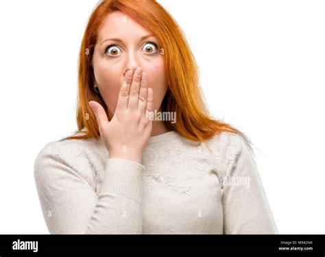 Beautiful Young Redhead Woman Covers Mouth In Shock Looks Shy Expressing Silence And Mistake