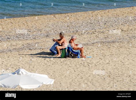 two older nudists back to back number 2591 Stock Photo - Alamy