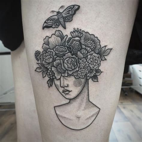 A Woman S Head With Flowers In Her Hair And A Butterfly On The Side