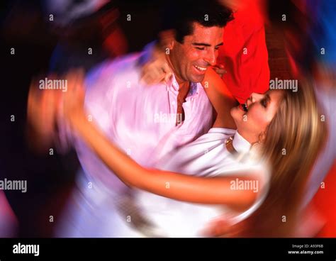 Attractive Couple Dancing At Nightclub Stock Photo Alamy