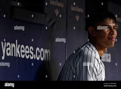 New York Yankees Pitcher Jonathan Loaisiga Smiles In The Dugout During