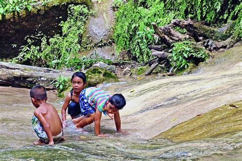 Children Playing In Saiyoknoi Waterfall Park Kanchanaburi Thailand