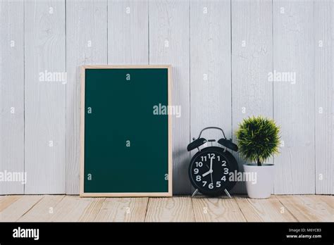 Blank Green Chalkborad With Wood Frame And Little Decorative Tree In White Vase And Vintage