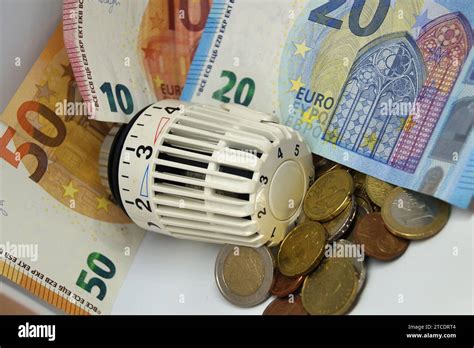 Thermostatic Valve Of A Heater With Euro Bills And Coins Symbol