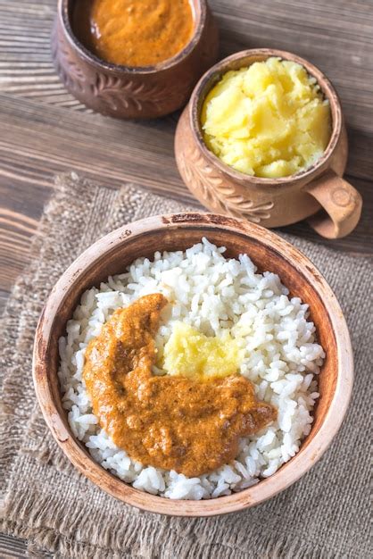 Premium Photo Bowl Of Rice With Indian Butter Sauce And Ghee