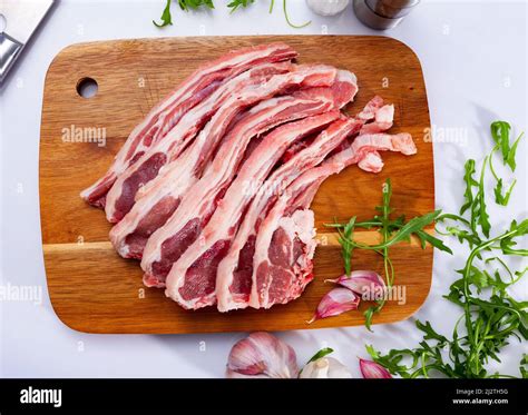 butcher cutting mutton meat pieces  res stock photography  images