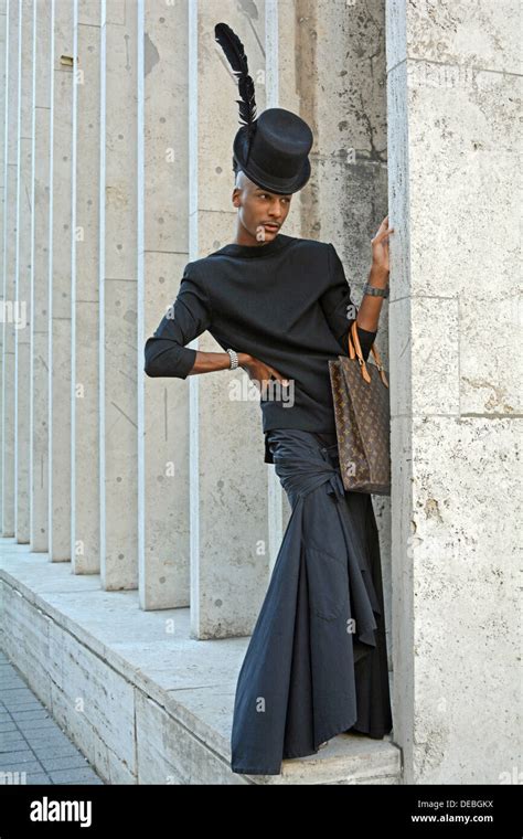 Portrait of stylist designer wearing an unusual black outfit at Fashion ...