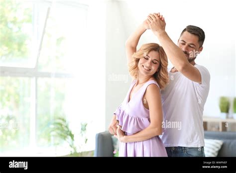happy dancing couple  home stock photo alamy