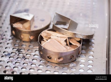 stainless steel wood chip smoker box  gas grill stock photo alamy