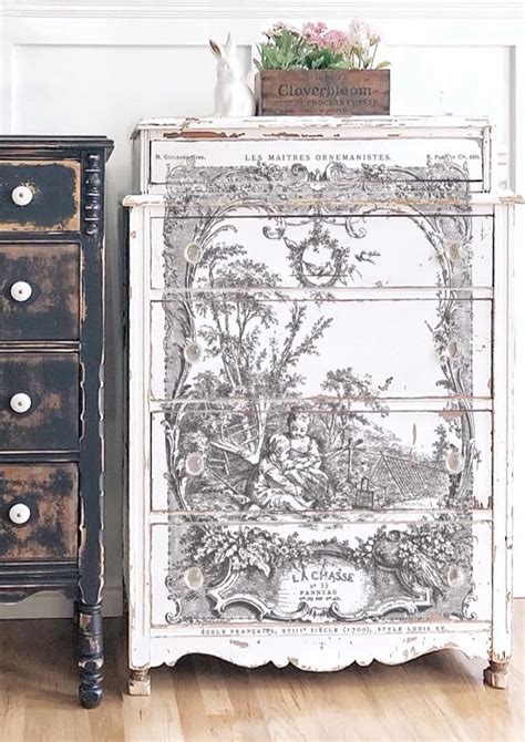 An Old Dresser Has Been Painted With Black And White To Look Like It Is