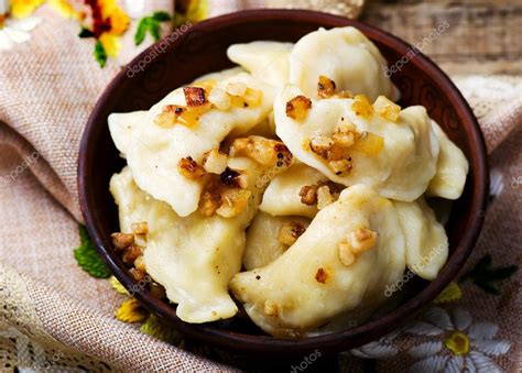 Potatoes vareniki in a ceramic bowl. — Stock Photo © zoryanchik #71025973