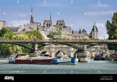 The bridge Pont des Arts or Passerelle des Arts across Seine river in ...