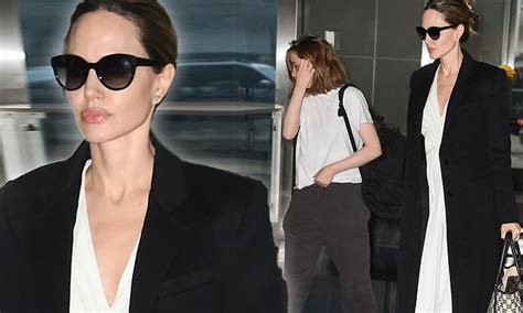 Angelina Jolie Looks Chic In Maxi Dress And Coat As She Arrives To Jfk