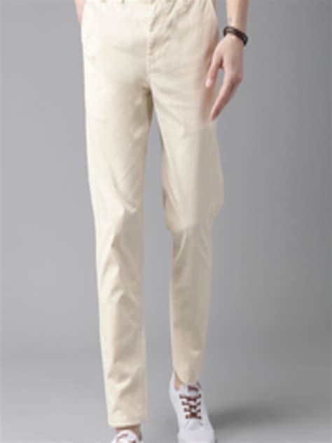 Buy The Roadster Lifestyle Co Men Cream Coloured Slim Fit Solid Chinos Trousers For Men