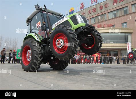 That's A Wheelie Clever Tractor! A stuntman performs a trick at wheel ...