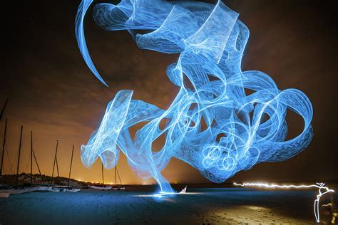 Blue kite on beach Photograph by Tony Ragusea - Fine Art America