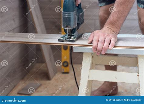 A Worker Using a Jigsaw Saws Laminate Boards Stock Image - Image of ...