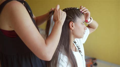 Girls Braiding Hair With A White Strand Of Hair 12130713 Stock Video At Vecteezy