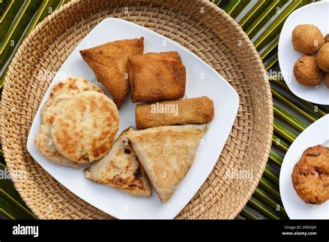 Authentic Sri Lankan different street food, short eats. Vegetable roti, coconut roti, cutlets ...