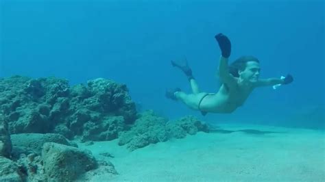 Freediver Breatholding Underwater In Thong