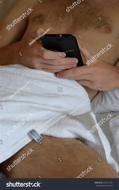 Naked Man Playing On His Phone Stock Photo Shutterstock