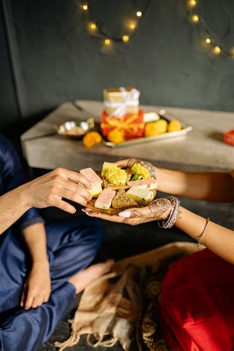 People Sharing Traditional Sweets · Free Stock Photo