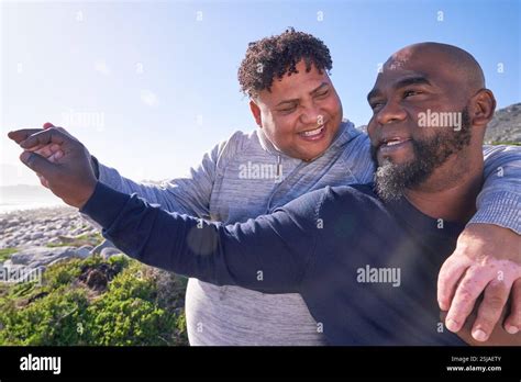 Gay Couple Embracing In Landscape Stock Photo Alamy
