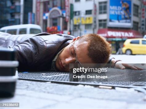 Dead Man Lying On The Ground High-Res Stock Photo - Getty Images