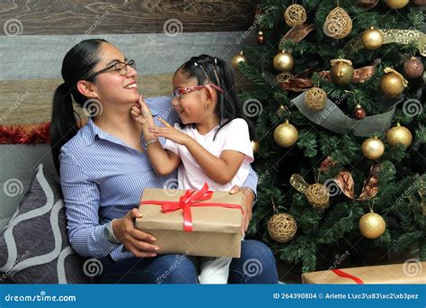Divorced Single Mom And Daughter Latina Brunettes With Glasses Have Christmas Presents Sitting