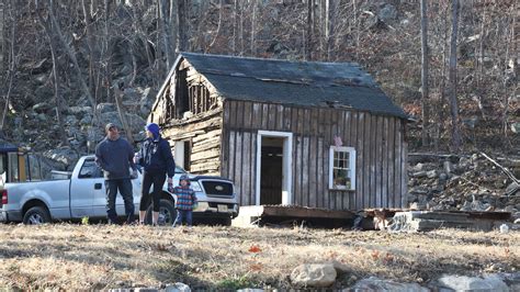Demolition Job Reveals Historic Log Cabin Hidden Behind Walls