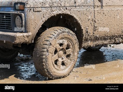 Dirty wheel of an off-road car after driving in the rain Stock Photo ...