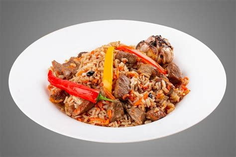 Premium Photo | Uzbekstyle pilaf on a decorative plate isolated