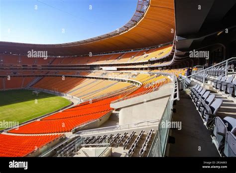 Empty Soccer Football stadium with orange seating Stock Photo - Alamy