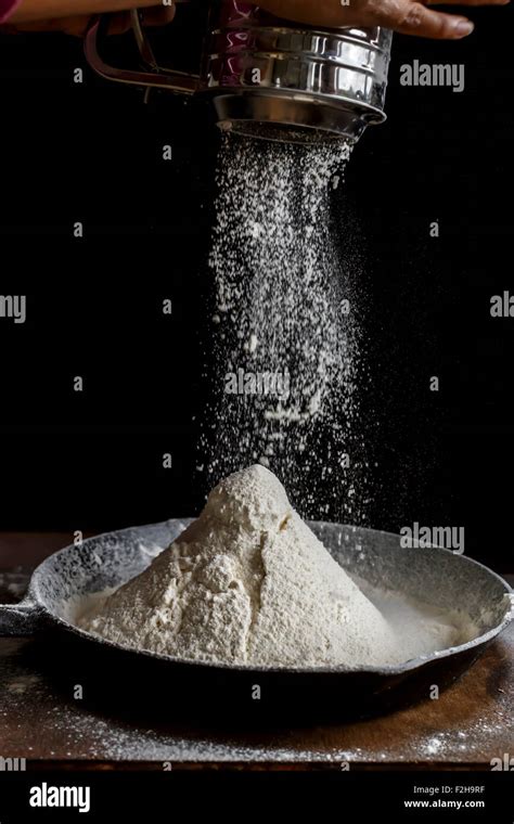 Sifting Flour, Ready for baking Stock Photo - Alamy